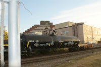 a black train with graffiti on it