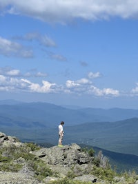 a person standing on top of a rocky mountain