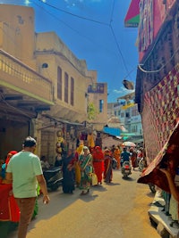 a group of people walking down a street