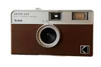 a camera with a brown and white color