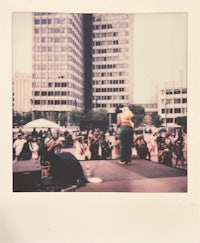 a polaroid photo of a crowd at a concert