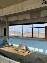 a view of a building under construction with a view of the ocean